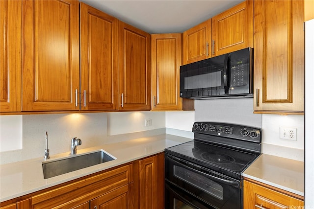46-255 Kahuhipa St Unit A1100, Kaneohe, HI 96744 - kitchen featuring black appliances, light countertops, and brown cabinets