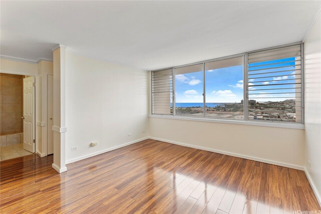 46-255 Kahuhipa St Unit A1100, Kaneohe, HI 96744 - unfurnished room with wood finished floors and crown molding