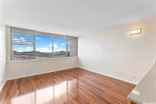 46-255 Kahuhipa St Unit A1100, Kaneohe, HI 96744 - empty room with baseboards and wood finished floors