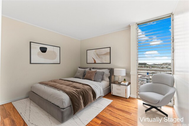 46-255 Kahuhipa St Unit A1100, Kaneohe, HI 96744 - bedroom featuring light wood finished floors and ornamental molding
