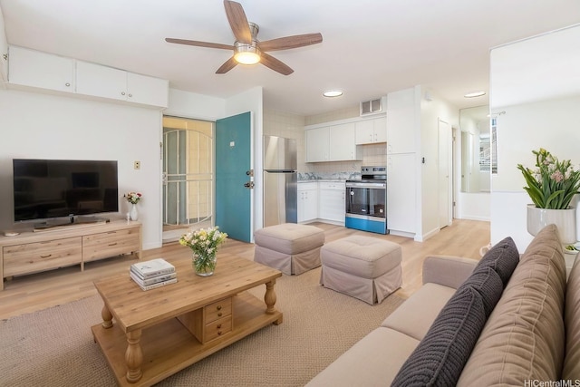 402 Iolani Ave Unit 204, Honolulu, HI 96813 - living room with ceiling fan, light wood-style flooring, and recessed lighting