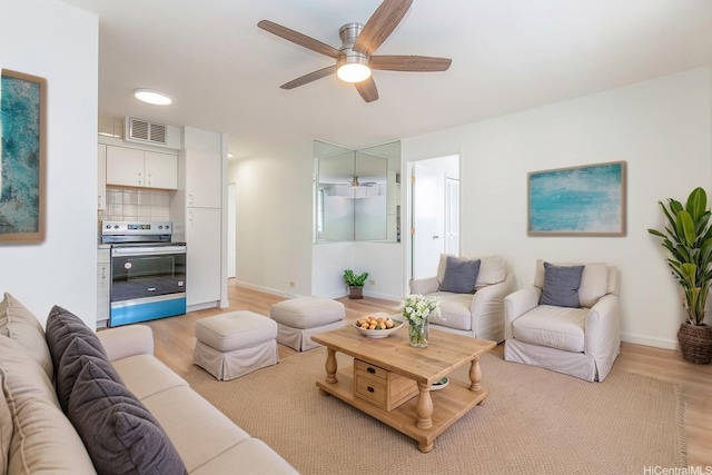 402 Iolani Ave Unit 204, Honolulu, HI 96813 - living area featuring a ceiling fan and light wood finished floors
