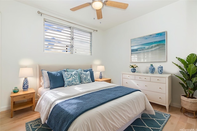 402 Iolani Ave Unit 204, Honolulu, HI 96813 - bedroom with light wood-style flooring and ceiling fan