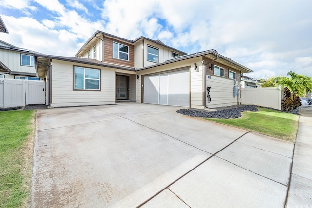 91-1542 Fort Weaver Rd, Ewa Beach, HI 96706 - view of front facade featuring driveway and a garage