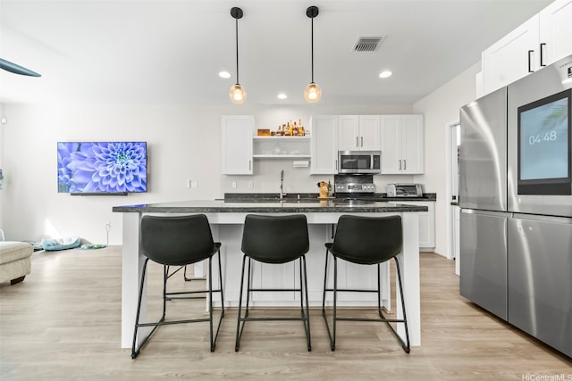 91-1542 Fort Weaver Rd, Ewa Beach, HI 96706 - kitchen with appliances with stainless steel finishes, a kitchen breakfast bar, open shelves, dark countertops, and recessed lighting