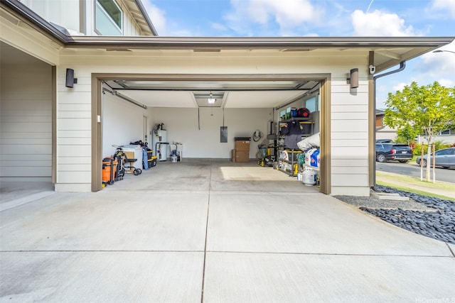 91-1542 Milimili St, Ewa Beach, HI 96706 - garage with concrete driveway, water heater, and electric panel