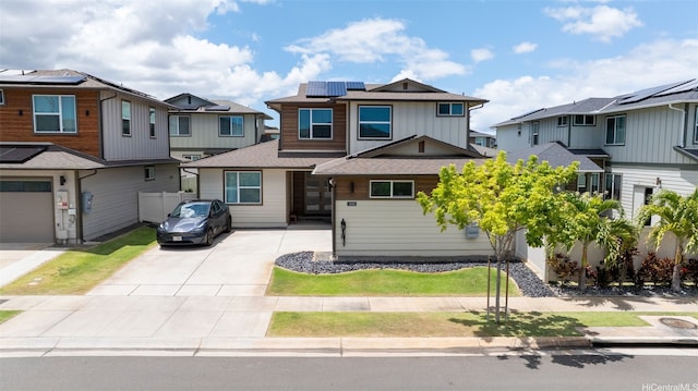 91-1542 Fort Weaver Rd, Ewa Beach, HI 96706 - view of front of property with roof mounted solar panels, a residential view, concrete driveway, and roof with shingles