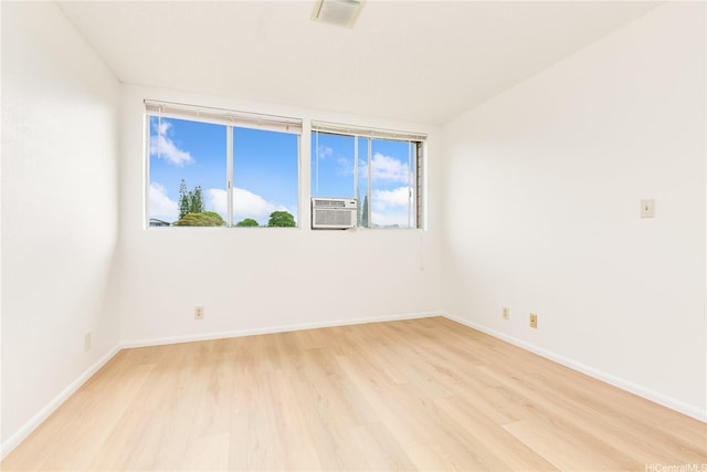 95-670 Hanile St Unit A202, Mililani, HI 96789 - spare room featuring light wood-style floors and baseboards