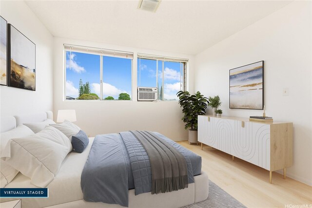 95-670 Hanile St Unit A202, Mililani, HI 96789 - bedroom with light wood-style floors and cooling unit