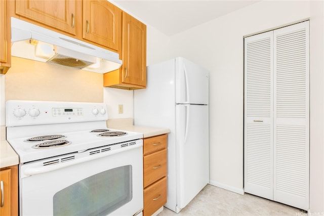 95-670 Hanile St Unit A202, Mililani, HI 96789 - kitchen with white appliances, under cabinet range hood, and light countertops