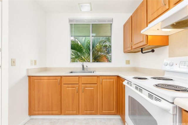 95-670 Hanile St Unit A202, Mililani, HI 96789 - kitchen with white range with electric cooktop, under cabinet range hood, light countertops, and brown cabinetry