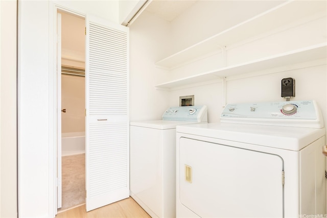 95-670 Hanile St Unit A202, Mililani, HI 96789 - laundry room with washer and clothes dryer and light wood-style floors