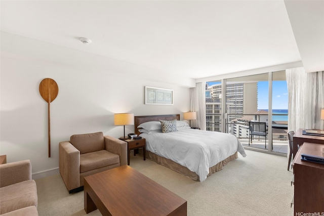 223 Saratoga Rd Unit 1916, Honolulu, HI 96815 - bedroom with light carpet, access to outside, floor to ceiling windows, and a water view