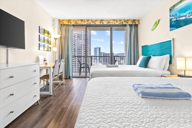 1850 Ala Moana Blvd Unit 1107, Honolulu, HI 96815 - bedroom featuring access to exterior, wood finished floors, an office area, and a city view