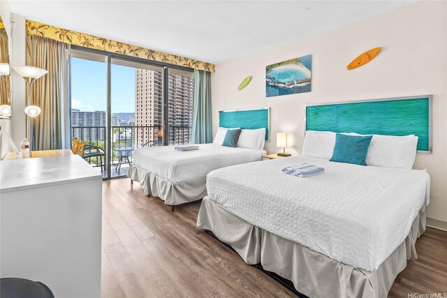 1850 Ala Moana Blvd Unit 1107, Honolulu, HI 96815 - bedroom featuring access to exterior, wood finished floors, and a city view