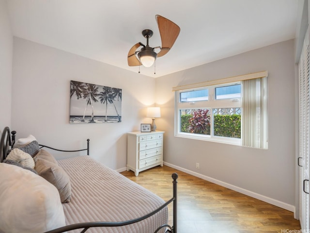 1586 Paukiki St, Kailua, HI 96734 - bedroom with light wood-style floors and a ceiling fan