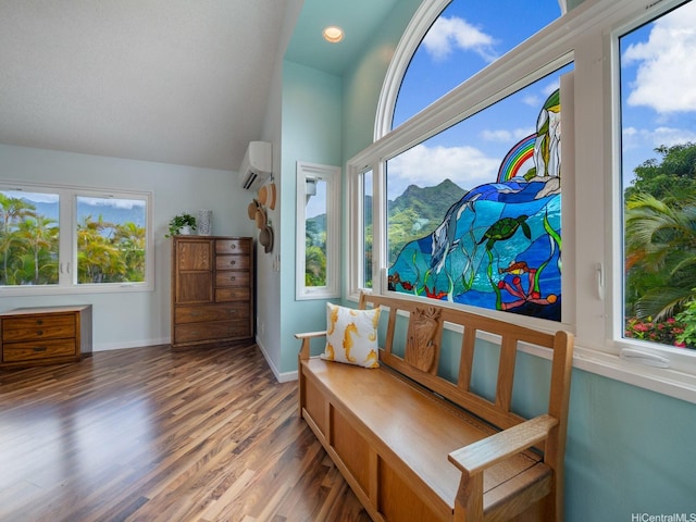 1586 Paukiki St, Kailua, HI 96734 - sitting room with wood finished floors, vaulted ceiling, and a wall mounted AC