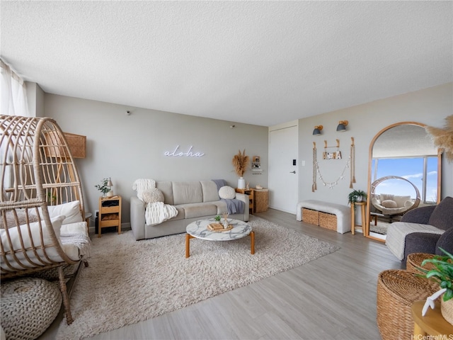 1060 Kamehameha Hwy Unit 2103A, Pearl City, HI 96782 - living area featuring a textured ceiling and wood finished floors