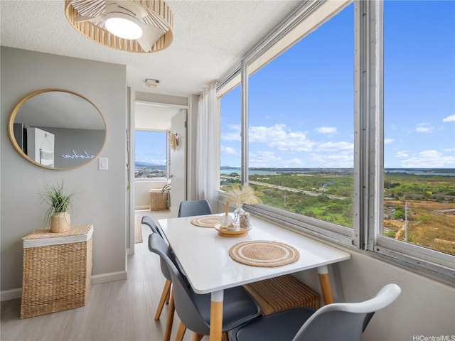 1060 Kamehameha Hwy Unit 2103A, Pearl City, HI 96782 - dining space with a textured ceiling and wood finished floors