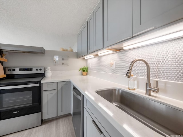 1060 Kamehameha Hwy Unit 2103A, Pearl City, HI 96782 - kitchen featuring stainless steel appliances, exhaust hood, gray cabinets, backsplash, and open shelves