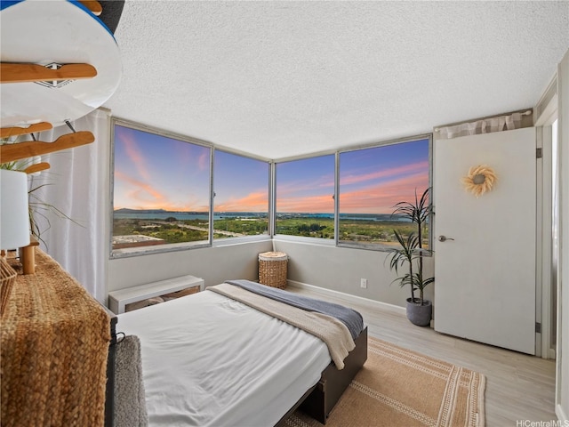 1060 Kamehameha Hwy Unit 2103A, Pearl City, HI 96782 - bedroom featuring a textured ceiling and wood finished floors