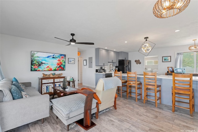 54-257 Kaipapau Loop, Hauula, HI 96717 - living room featuring a chandelier, light wood-type flooring, recessed lighting, and a ceiling fan