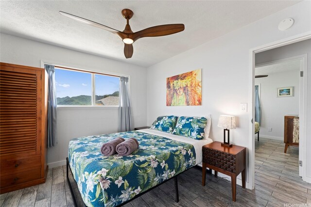 54-257 Kaipapau Loop, Hauula, HI 96717 - bedroom with wood finished floors and a ceiling fan