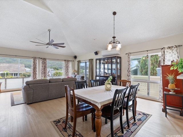1549 Kanapuu Dr, Kailua, HI 96734 - dining room with a textured ceiling, plenty of natural light, light wood-style floors, vaulted ceiling, and ceiling fan