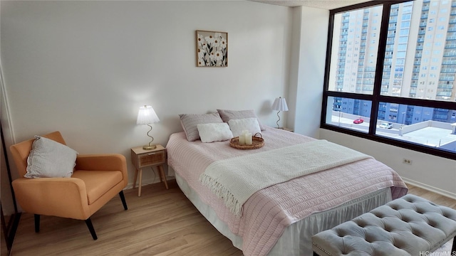 876 Curtis St Unit 2109, Honolulu, HI 96813 - bedroom with light wood-style floors and baseboards