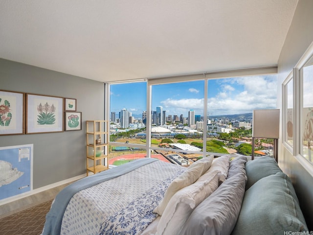 1288 Kapiolani Blvd Unit I2808, Honolulu, HI 96814 - bedroom with a skyline view and wood finished floors