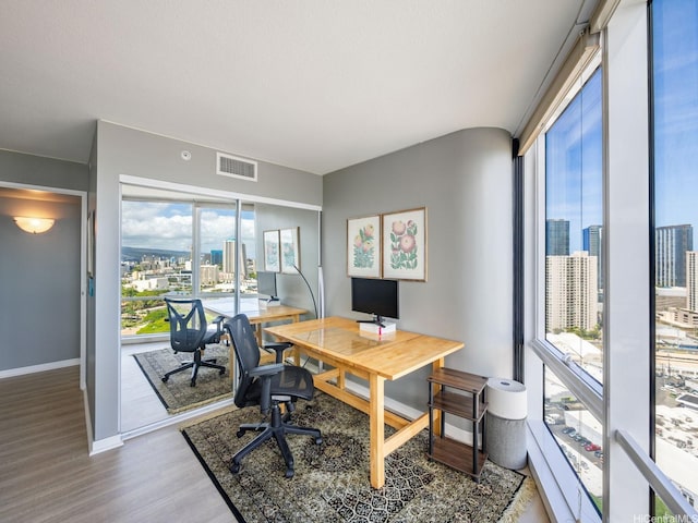 1288 Kapiolani Blvd Unit I2808, Honolulu, HI 96814 - home office featuring wood finished floors and plenty of natural light