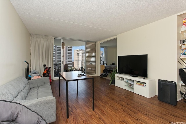 469 Ena Rd Unit 2304, Honolulu, HI 96815 - living area featuring wood finished floors and a textured ceiling
