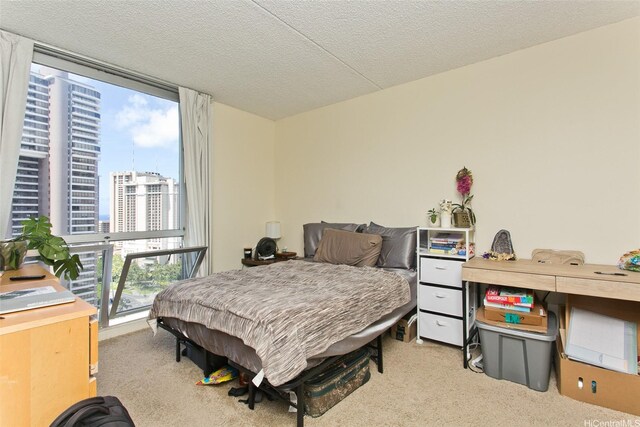 469 Ena Rd Unit 2304, Honolulu, HI 96815 - carpeted bedroom with multiple windows, a city view, and a textured ceiling