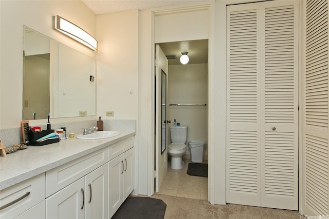 469 Ena Rd Unit 2304, Honolulu, HI 96815 - bathroom featuring a closet, vanity, and tile patterned floors