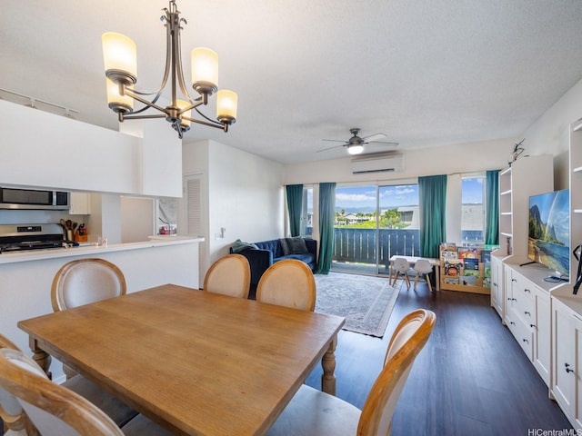 91-265 Hanapouli Cir Unit 16J, Ewa Beach, HI 96706 - dining area featuring a wall unit AC, a chandelier, dark wood-style floors, and ceiling fan