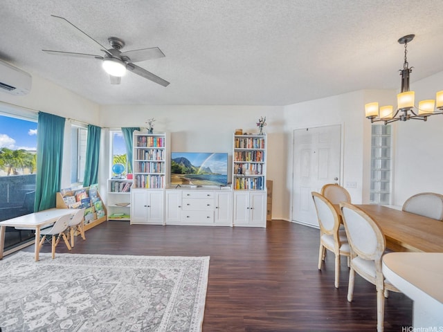 91-265 Hanapouli Cir Unit 16J, Ewa Beach, HI 96706 - living room featuring dark wood-type flooring, a chandelier, a textured ceiling, a ceiling fan, and a wall mounted AC