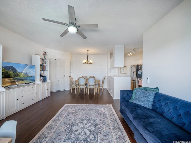 91-265 Hanapouli Cir Unit 16J, Ewa Beach, HI 96706 - living area featuring dark wood-style flooring, a chandelier, and a ceiling fan