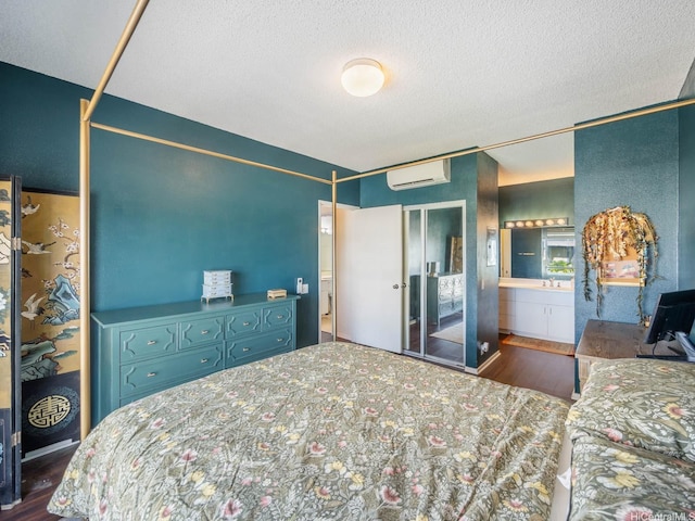 91-265 Hanapouli Cir Unit 16J, Ewa Beach, HI 96706 - bedroom with an AC wall unit, wood finished floors, a textured ceiling, and a closet