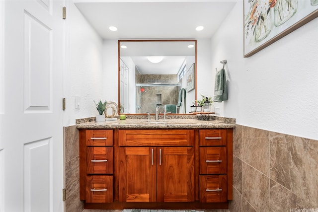 46-160 Kiowai St Unit 2322, Kaneohe, HI 96744 - full bath with tile walls, vanity, a shower stall, a wainscoted wall, and recessed lighting
