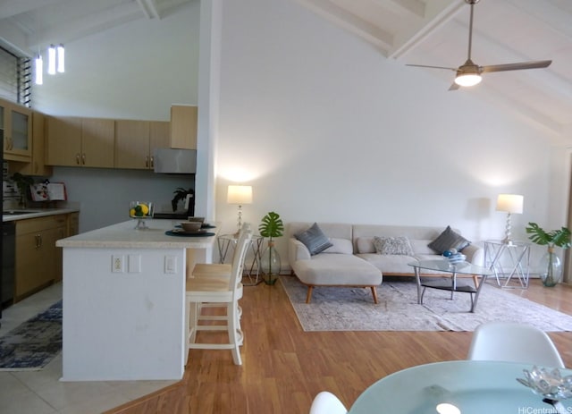 45-995 Wailele Rd Unit 29, Kaneohe, HI 96744 - kitchen with high vaulted ceiling, light countertops, beam ceiling, a kitchen breakfast bar, and a peninsula