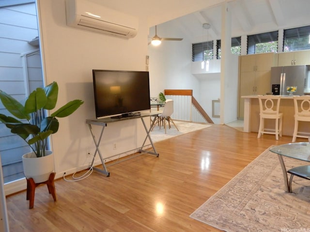 45-995 Wailele Rd Unit 29, Kaneohe, HI 96744 - living room featuring a wall unit AC, light wood-style floors, and ceiling fan