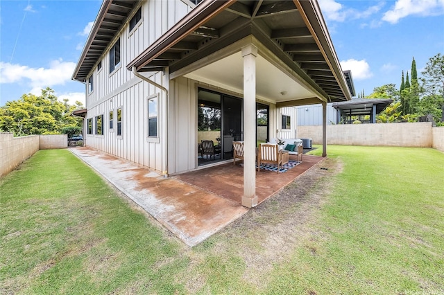 95-1021 Hoama St, Mililani, HI 96789 - rear view of house with board and batten siding, a patio area, and a fenced backyard