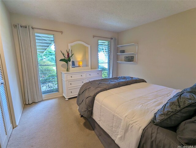 46-426 Hololio St, Kaneohe, HI 96744 - bedroom featuring light colored carpet and a textured ceiling