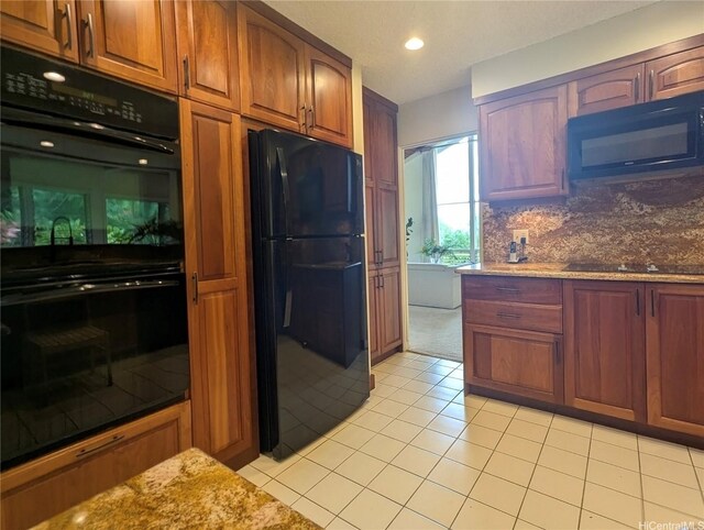 46-426 Hololio St, Kaneohe, HI 96744 - kitchen featuring black appliances, light tile patterned floors, light stone countertops, recessed lighting, and brown cabinets