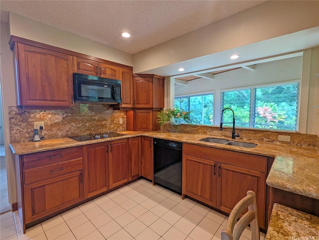 46-426 Hololio St, Kaneohe, HI 96744 - kitchen featuring black appliances, light stone counters, decorative backsplash, brown cabinetry, and a textured ceiling