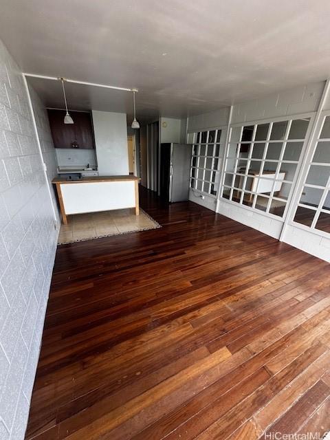 53-549 Kamehameha Hwy Unit 618, Hauula, HI 96717 - unfurnished living room with dark wood-style floors