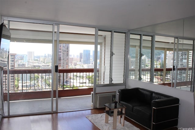 775 Kinalau Pl Unit 2107, Honolulu, HI 96813 - sunroom / solarium featuring a city view, wood finished floors, and healthy amount of natural light