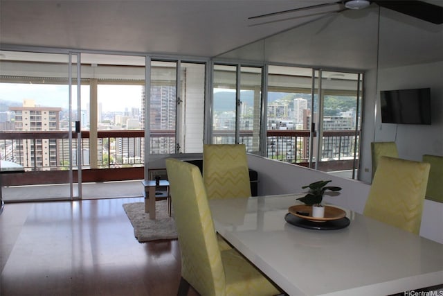 775 Kinalau Pl Unit 2107, Honolulu, HI 96813 - dining space featuring a city view, ceiling fan, and wood finished floors