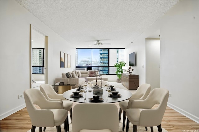 876 Curtis St Unit 3009, Honolulu, HI 96813 - dining space featuring a textured ceiling, light wood finished floors, and ceiling fan