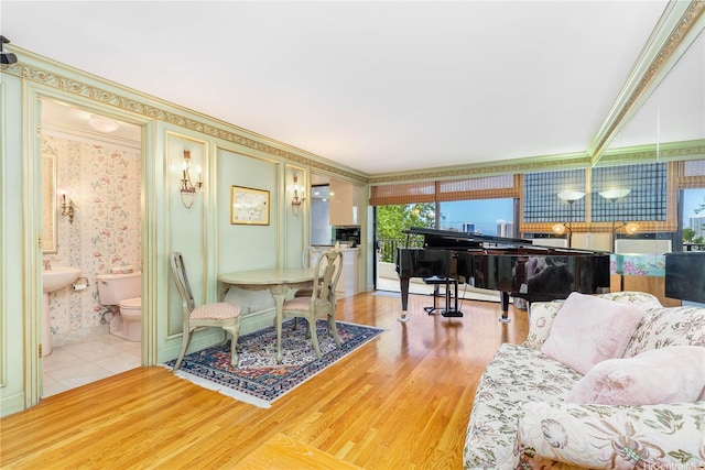 965 Prospect St Unit 604, Honolulu, HI 96822 - living area featuring ornamental molding, wood finished floors, and wallpapered walls